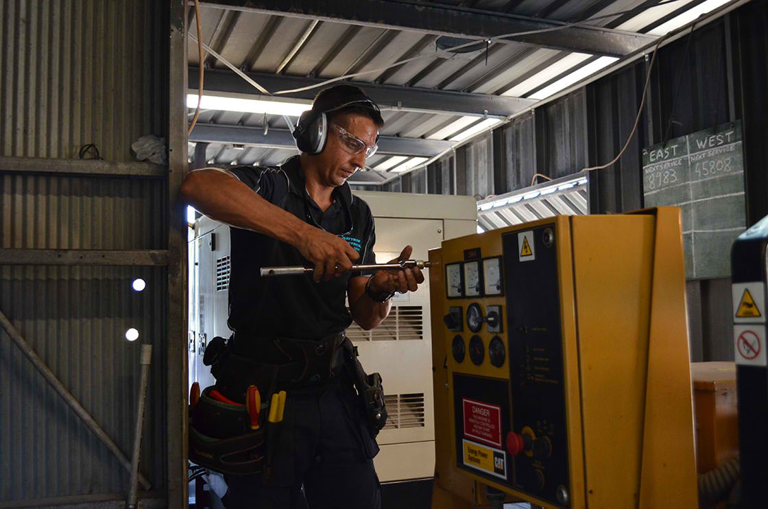 Jono-Wattnow-Electrical-director-installing-generator-1 Cone Bay Generator 2014